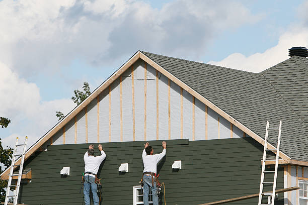 Professional Siding Contractor technician working in Canton, MA